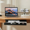 Doctor Desk black under desk cable tray clamped to a wooden desk holding a power strip and cables