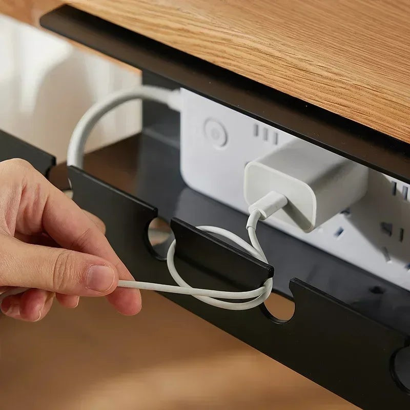 Doctor Desk black metal under desk cable tray with clamp mount holding a power strip and cables