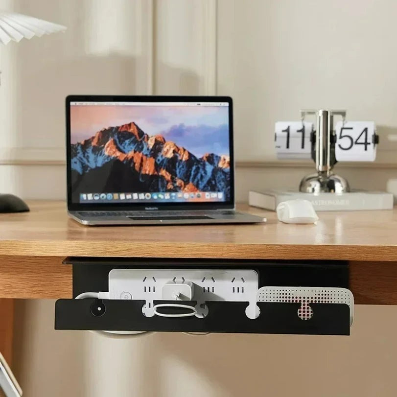 Doctor Desk black under desk cable management tray with clamp mount holding a power strip on a wooden desk