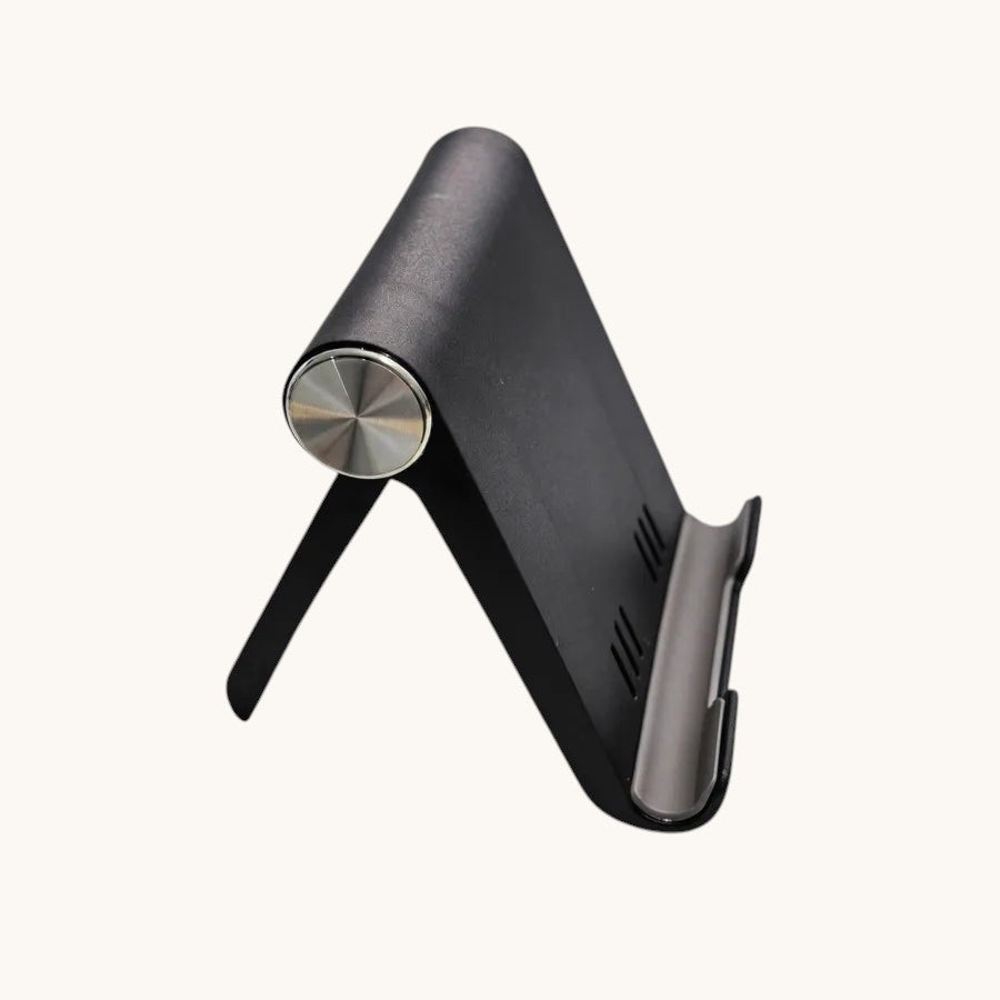 Doctor Desk black foldable phone stand with adjustable angle and anti-slip base on a light grey background