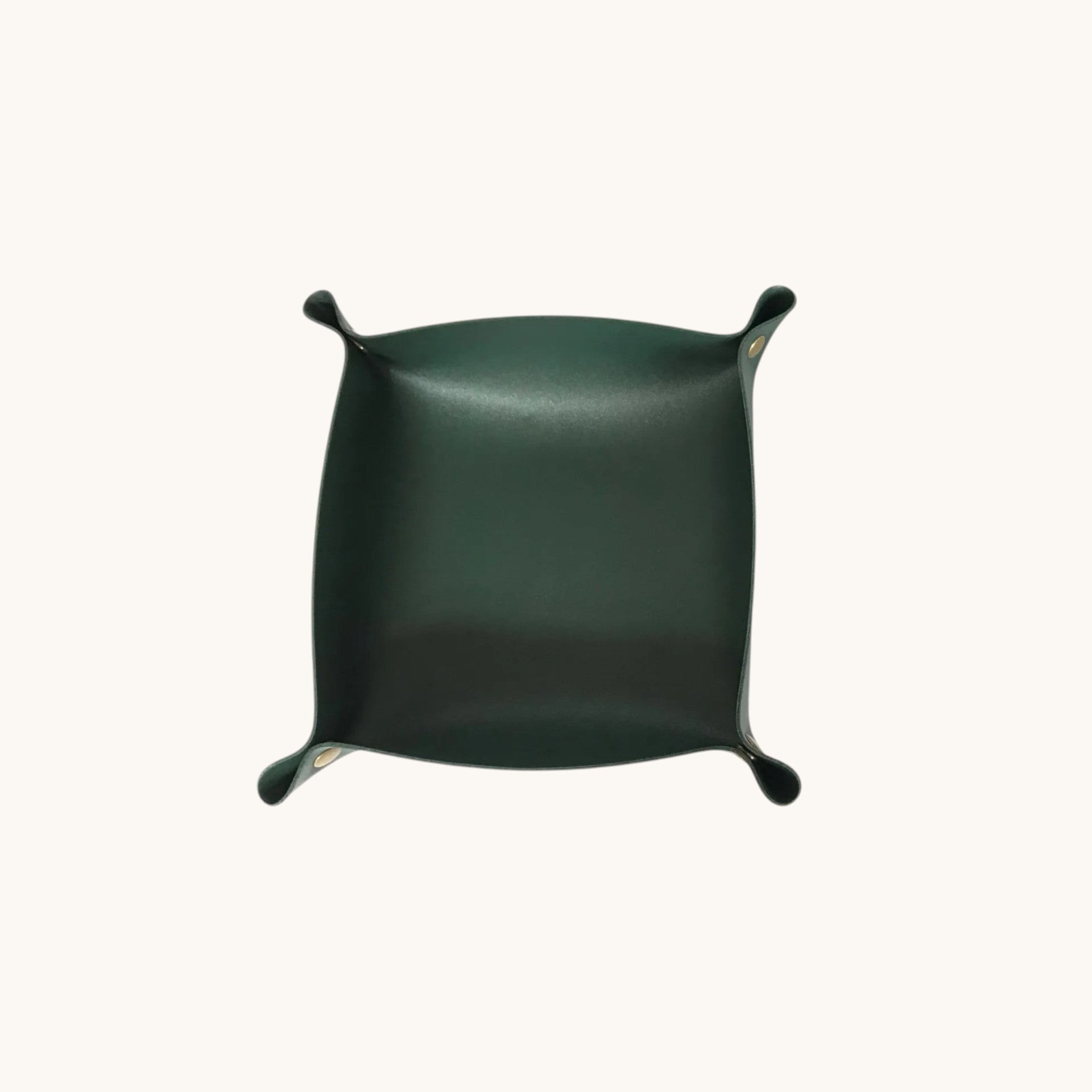 Doctor Desk dark green foldable PU leather valet tray for organizing keys, coins, and jewelry on a desktop