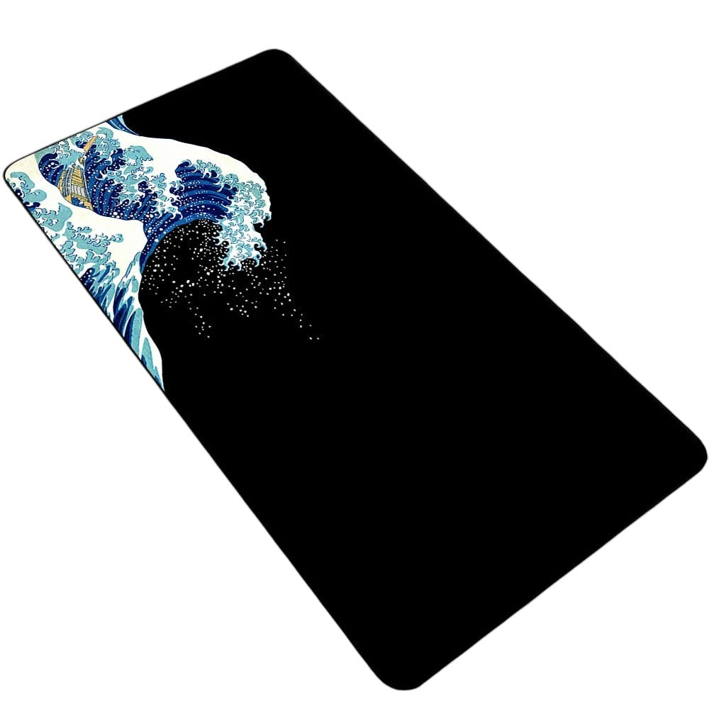 Doctor Desk XXL Japanese wave desk mat with a black and blue artistic design, non-slip rubber base, and stitched edges