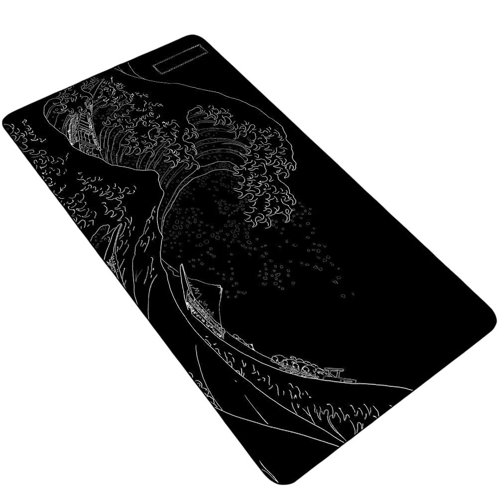 Doctor Desk XXL desk mat featuring a black and white Japanese wave design with stitched edges and non-slip rubber base.