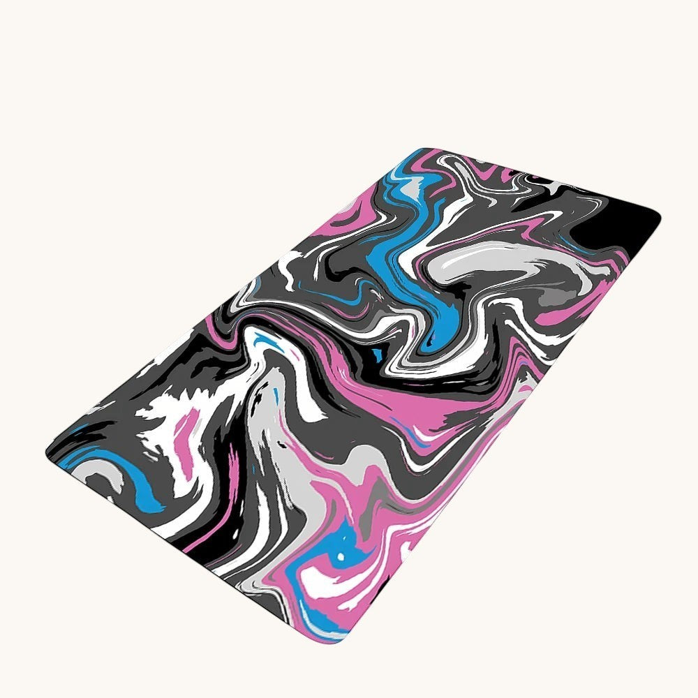 Doctor Desk XXL desk mat featuring a vibrant liquid swirl pattern in black, white, pink, and blue with stitched edges.