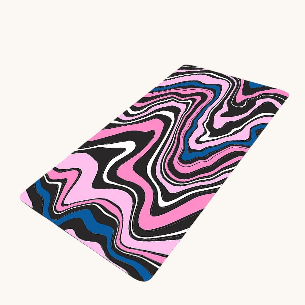 Doctor Desk XXL desk mat featuring a pink, blue, and black liquid swirl pattern with stitched edges and rubber base.