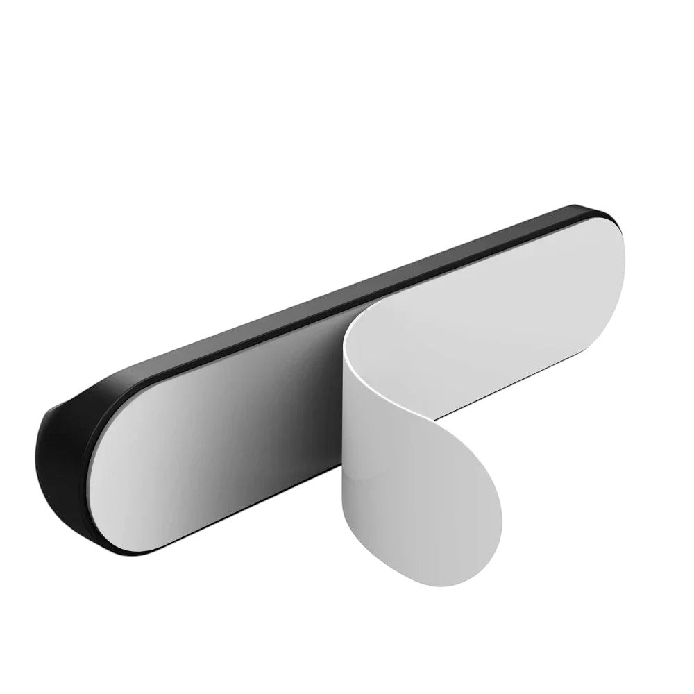 Doctor Desk grey silicone cable clip with self-adhesive backing peeled back for desk cable management