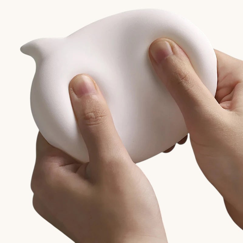 Doctor Desk ergonomic silicone mouse wrist rest being squeezed to show soft, flexible bubble shape