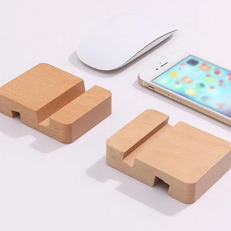 Doctor Desk wooden double slot phone stand on a desk next to a smartphone and computer mouse